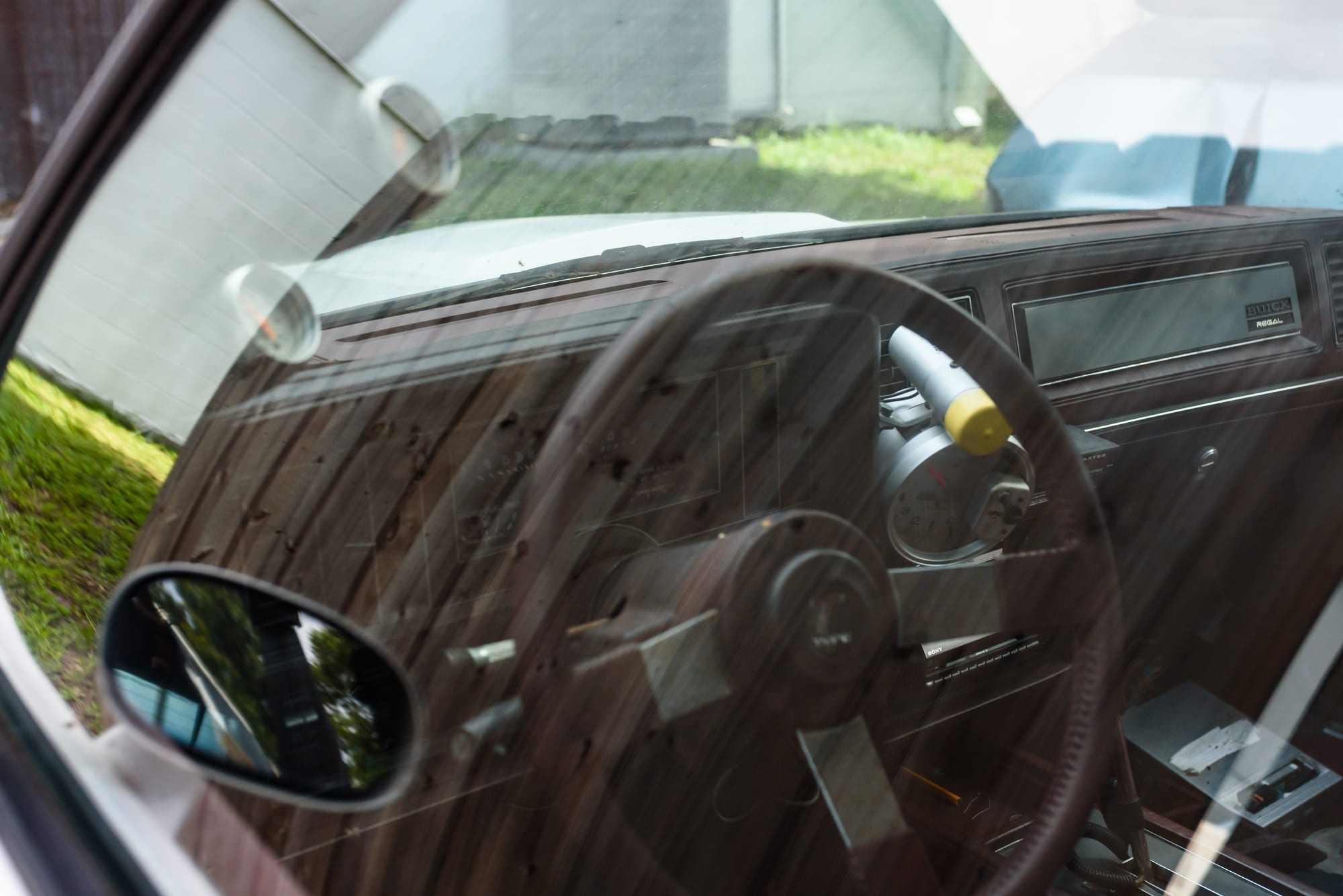 The dashboard and steering wheel of a classic car in for service