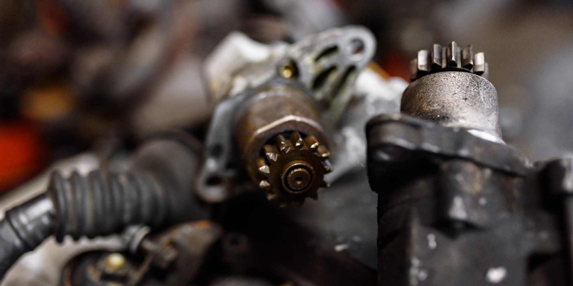 A close-up of greasy starter-motor gears pulled from an engine