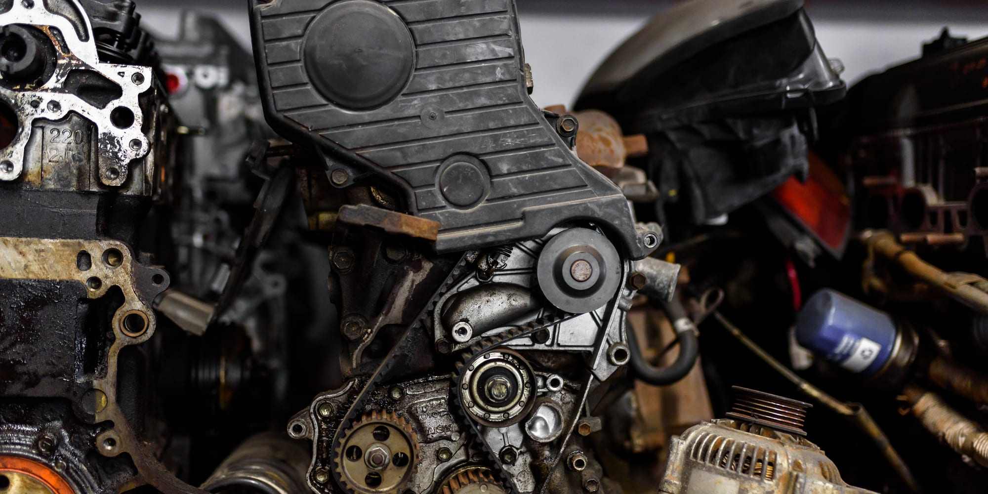 A partially disassembled engine showing its timing gears and internal components