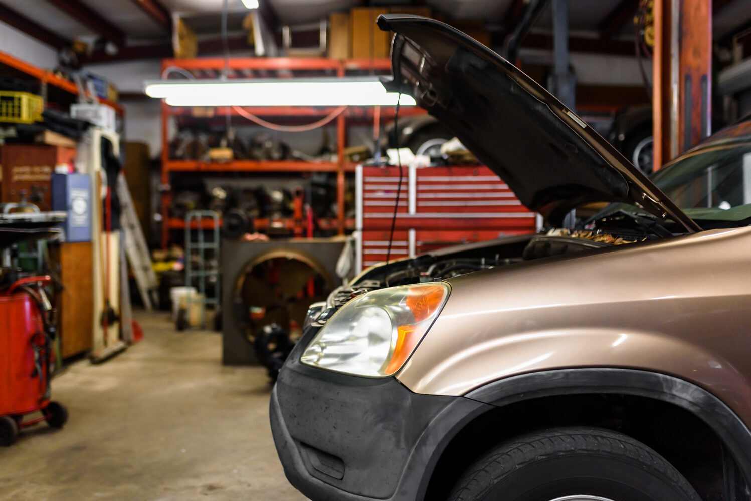 Factory-scheduled maintenance being performed on a vehicle at Master Team Automotive