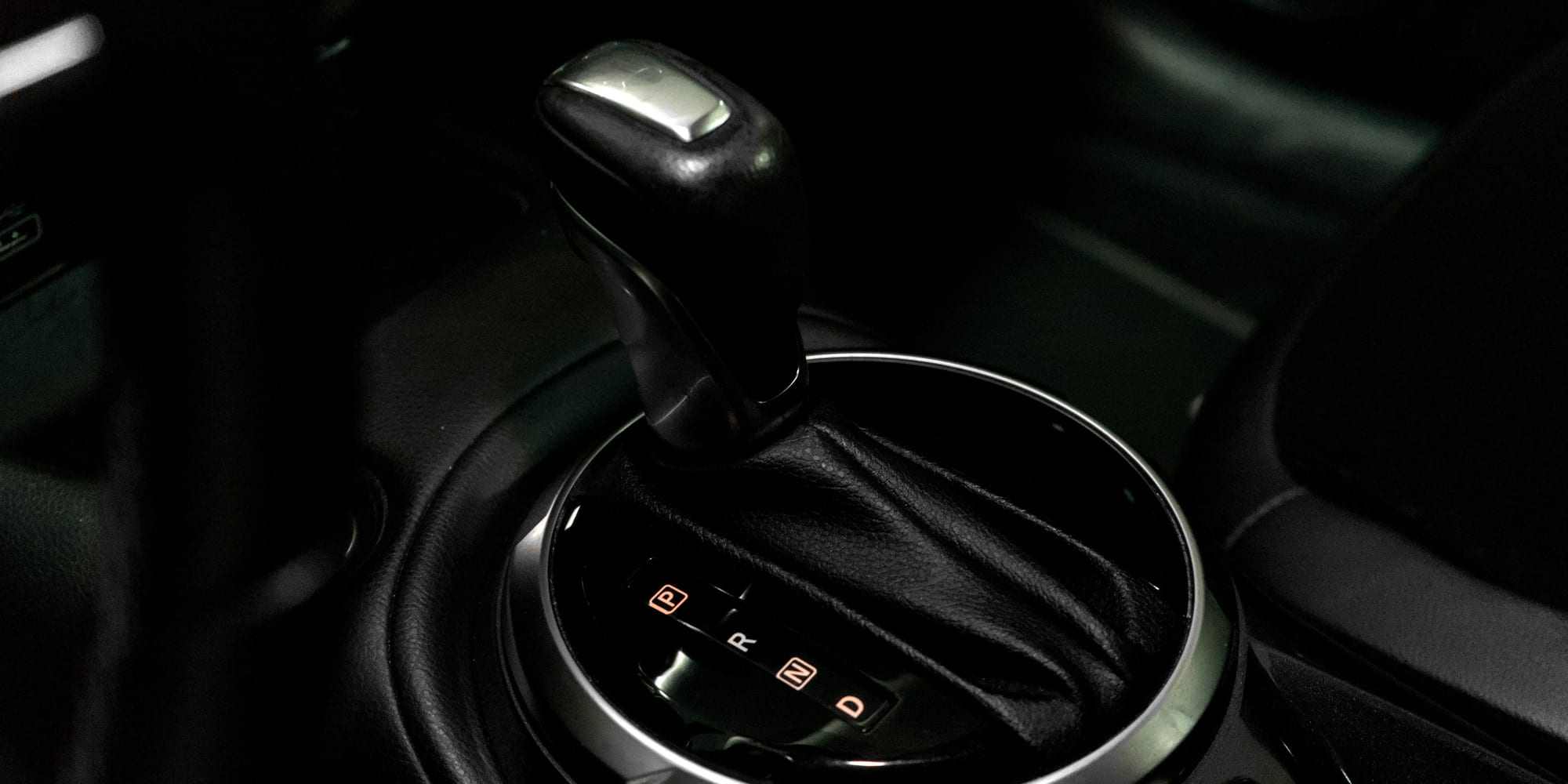 An illuminated automatic gear selector showing the P, R, N, and D positions